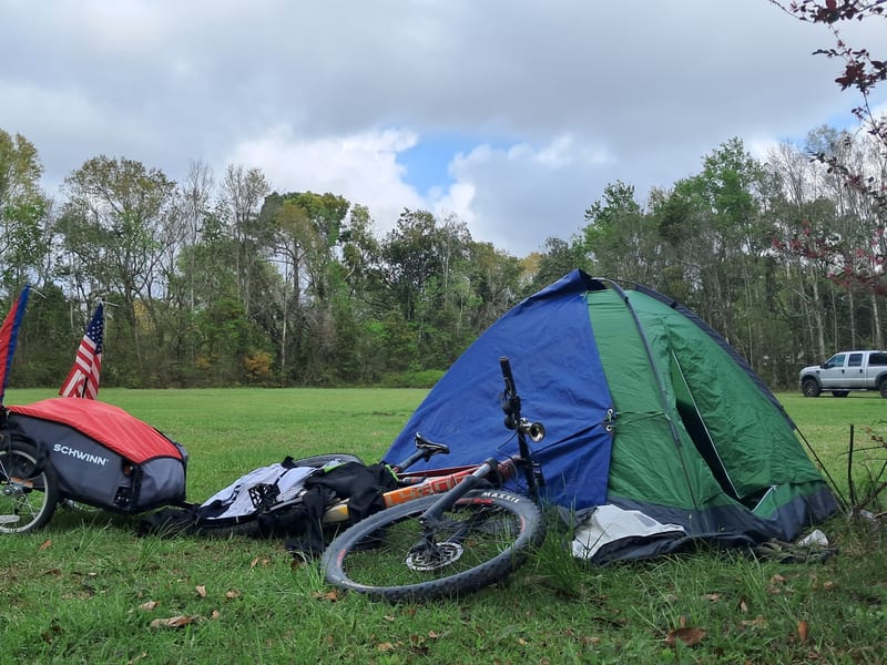 Bike camping setup in grassy field